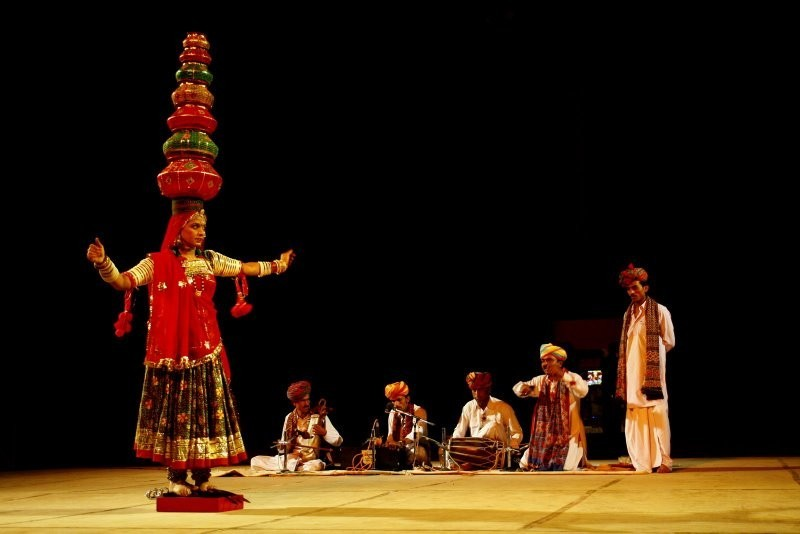 Traditional Rajasthani folk dance with musicians performing on stage showcasing Rajasthan's cultural heritage