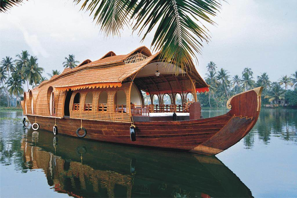 Traditional Kerala houseboat on the serene backwaters, a popular and safe solo travel experience in Kerala, India